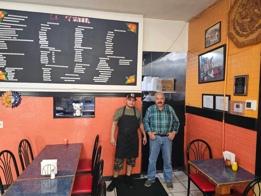 The La Tapatia dining room in Racine, with the full menu written on the board on the wall